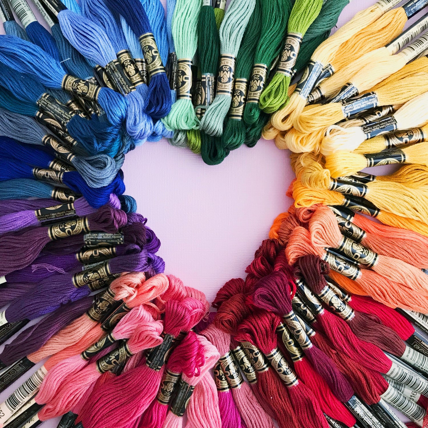 Image of multi-colored thread arranged into a heart
